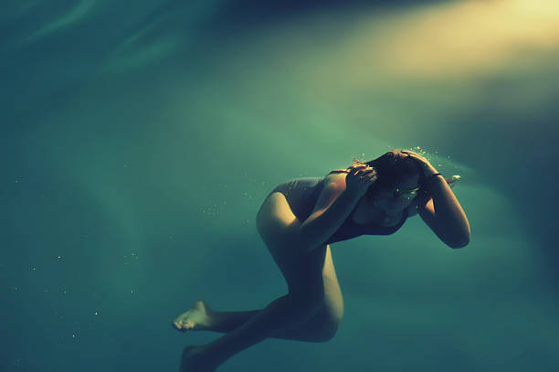 istock Girl swimming underwater in sea 534756429