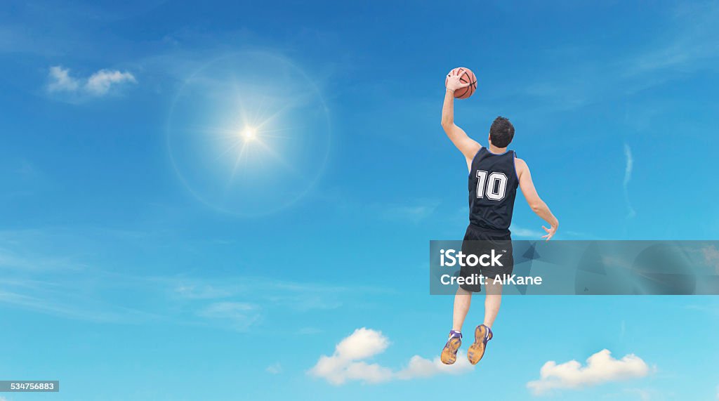 slam dunk in the sky basketball player dunking in the sky 2015 Stock Photo