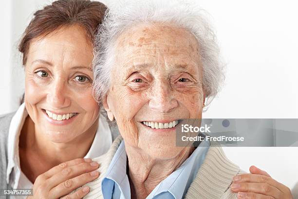 Senior Woman With Her Caregiver At Home Stock Photo - Download Image Now - Home Caregiver, Nursing Home, Nurse