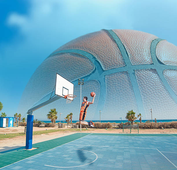 istock basketball player dunking by the sea 534757441