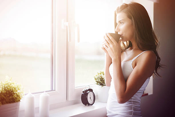 un ottimo modo per sveglia! - waking up window women morning foto e immagini stock