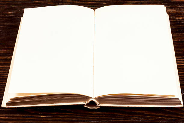 istock Open Book On Wooden Desk. 534758253