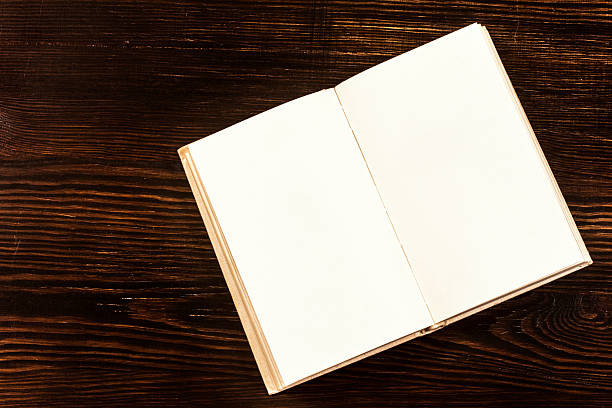 istock Open Book On Wooden Desk. 534758261