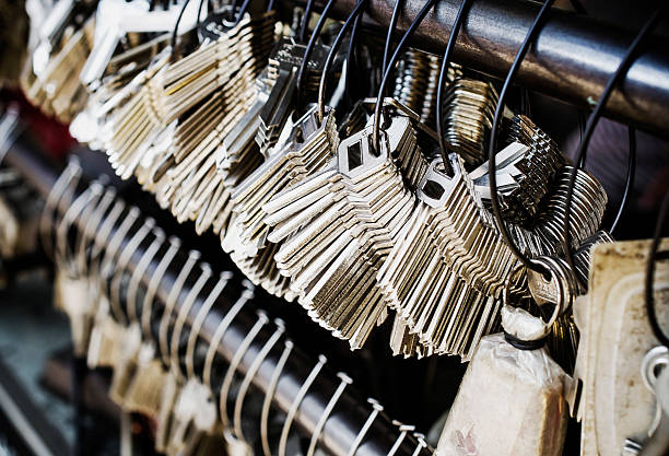 istock Bunch of keys hanging on hooks on a steel beam 534759401