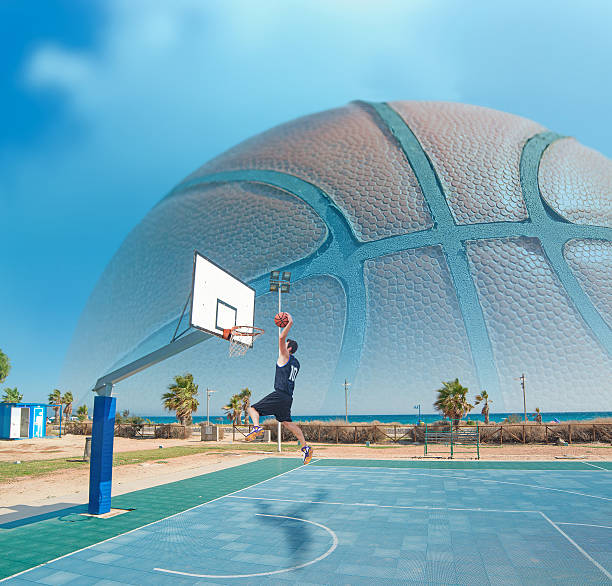 istock basketball player dunking by the sea 534760333