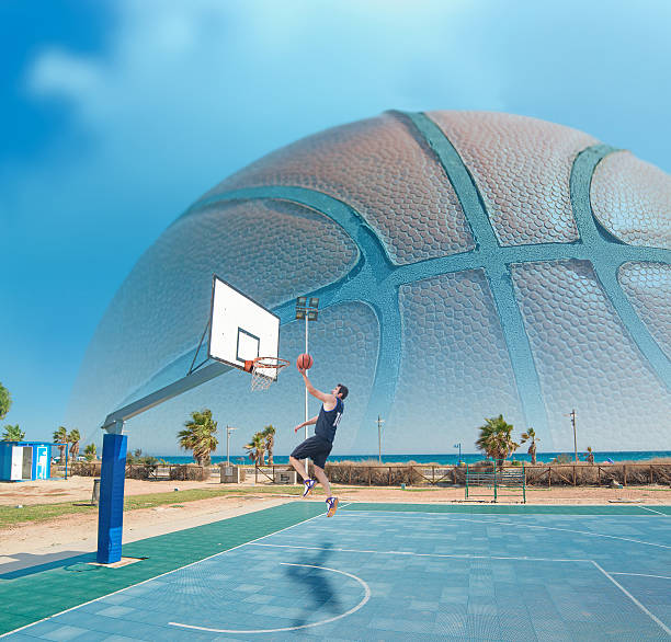 istock basketball player shooting by the sea 534760345