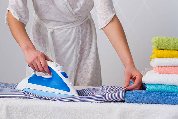 istock housewife   ironing shirt 534760643