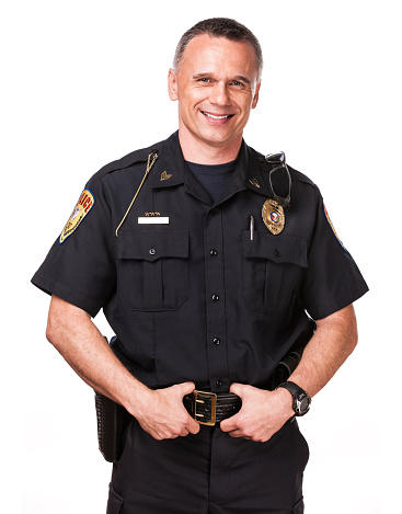 An authentic police officer. Isolated on a pure white background.