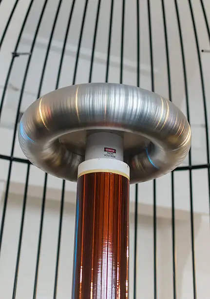 Photo of Resonant transformer in faraday cage. Tesla coil.