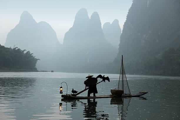 istock Fishing with cormorants birds in Yangshuo 534762365