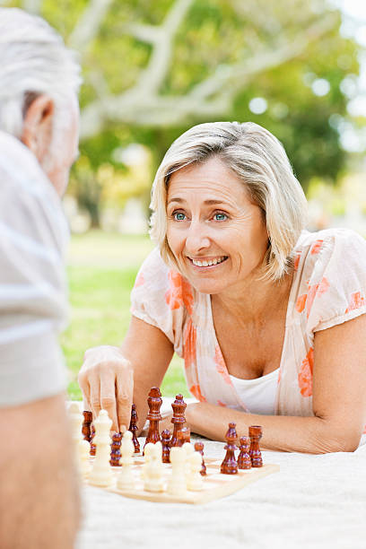 istock Senior Couple Playing Chess in the Park 534763167