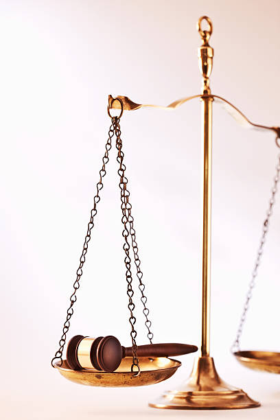 istock Gavel In One Side Of Weight Scale 534763495