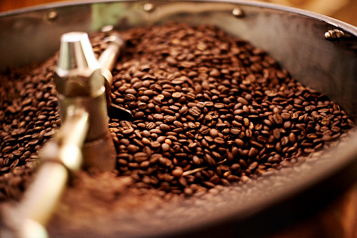 Cropped closeup shot of coffee beans being roasted