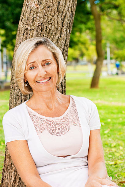 istock Senior Woman Sitting Under a Tree 534784071