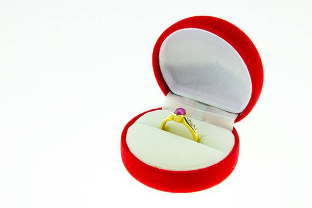 istock Gold ring with red gem in red box isolated 534784795