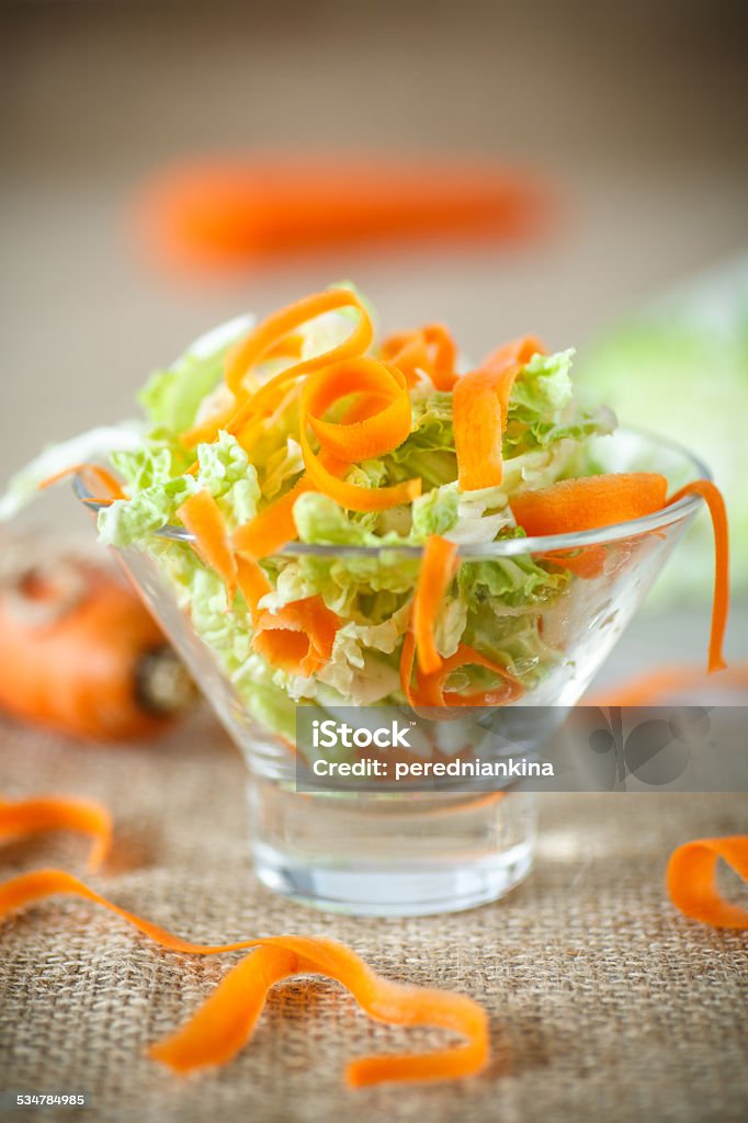 salad of fresh chopped cabbage and carrots salad of fresh chopped cabbage and carrots on the table 2015 Stock Photo