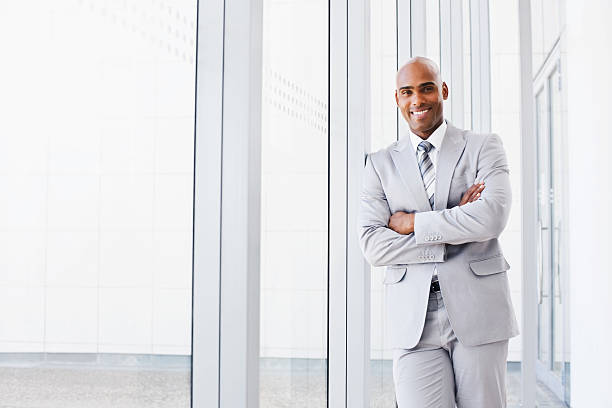 istock Happy business man with hands folded in office 534786215