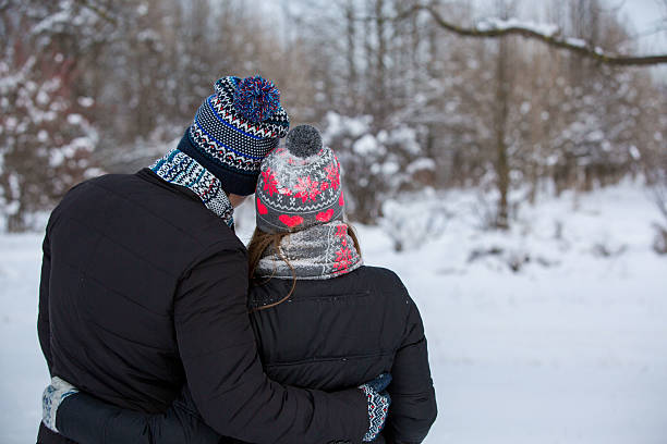 istock Couple in love in a snowy park 534788711