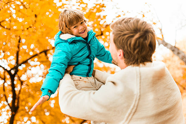 istock Playful father and son in autumn day. 534789817