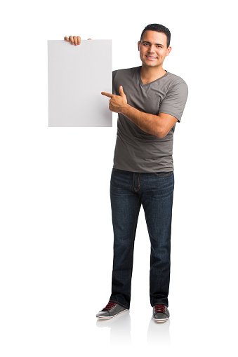 Portrait of a happy man showing a placard isolated over white background