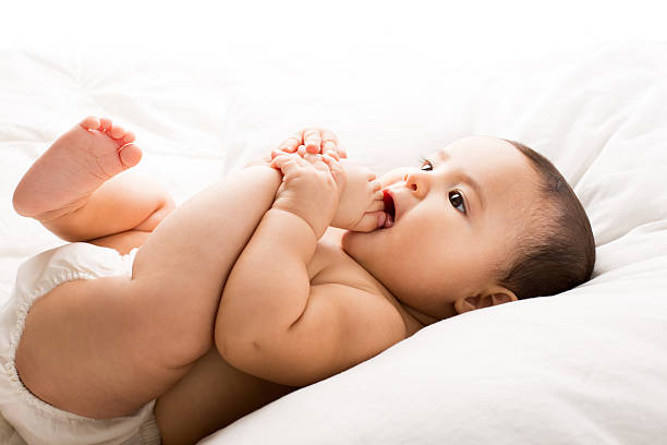 istock Cute baby girl on bed 534798637