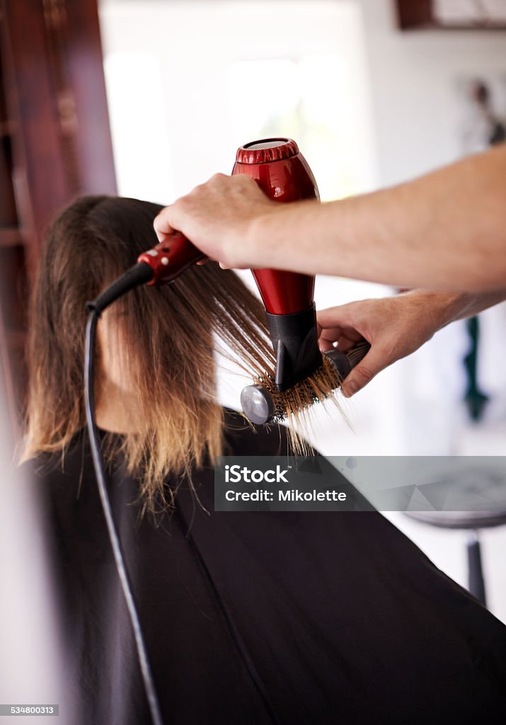 Make every day a good hair day Cropped shot of a woman getting her hair done 2015 Stock Photo