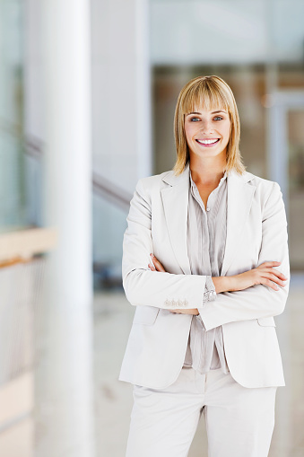 Beautiful mature business woman hands folded smiling at the workplace