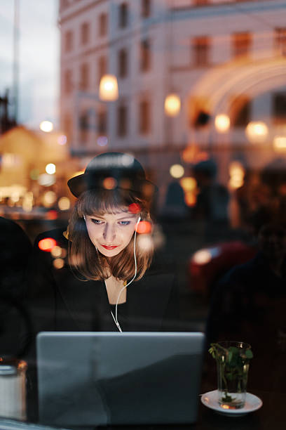 istock Woman using Laptop in Cafe with Free WiFi 534801319
