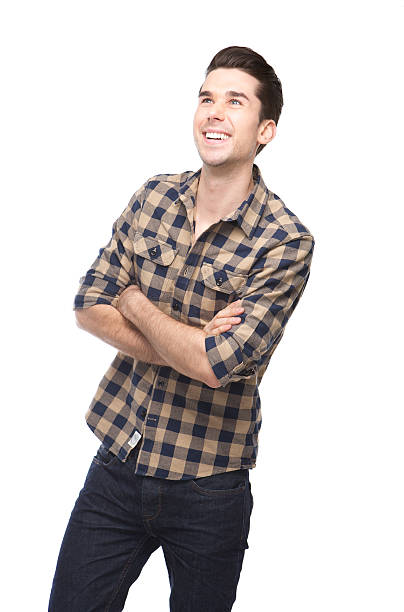 istock Happy young man smiling with arms crossed 534801801