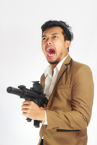 Mature Business Man Holding Gun