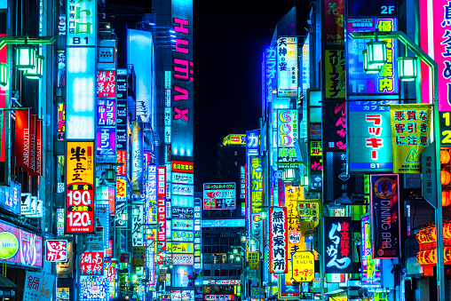 Tokyo, Japan - November 13, 2014: Billboards and neon signs line Shinjuku's Kabuki-cho district. The area is a nightlife district known as Sleepless Town.