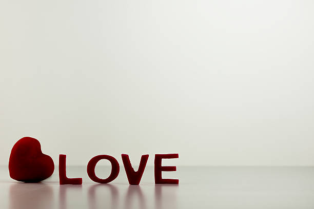 istock Red LOVE Letters with Heart on Table 534824019