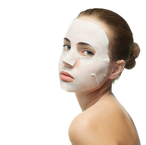 istock Young woman with beauty mask on her face. 534824285