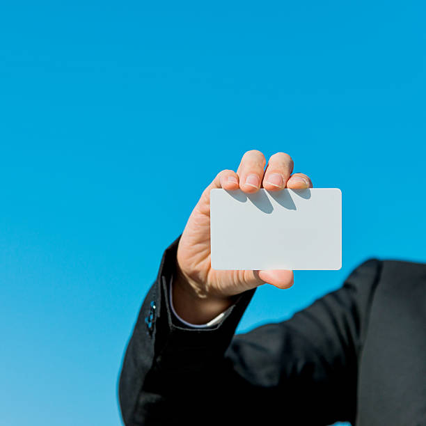istock holding a business card 534824555