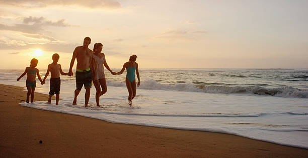 istock Family on vacation spending time at the beach 534824563