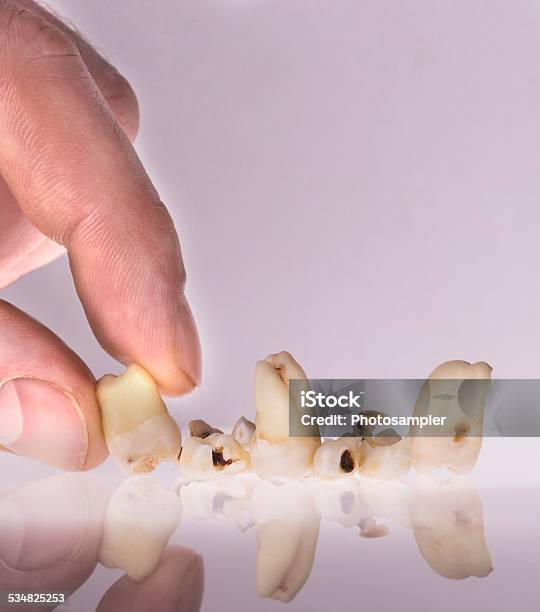 Hand Stacking Teeth Stock Photo - Download Image Now - 2015, Body Care, Care