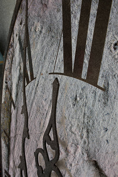 istock Close-up of clock with black hands and numbers showing midnight 534827293