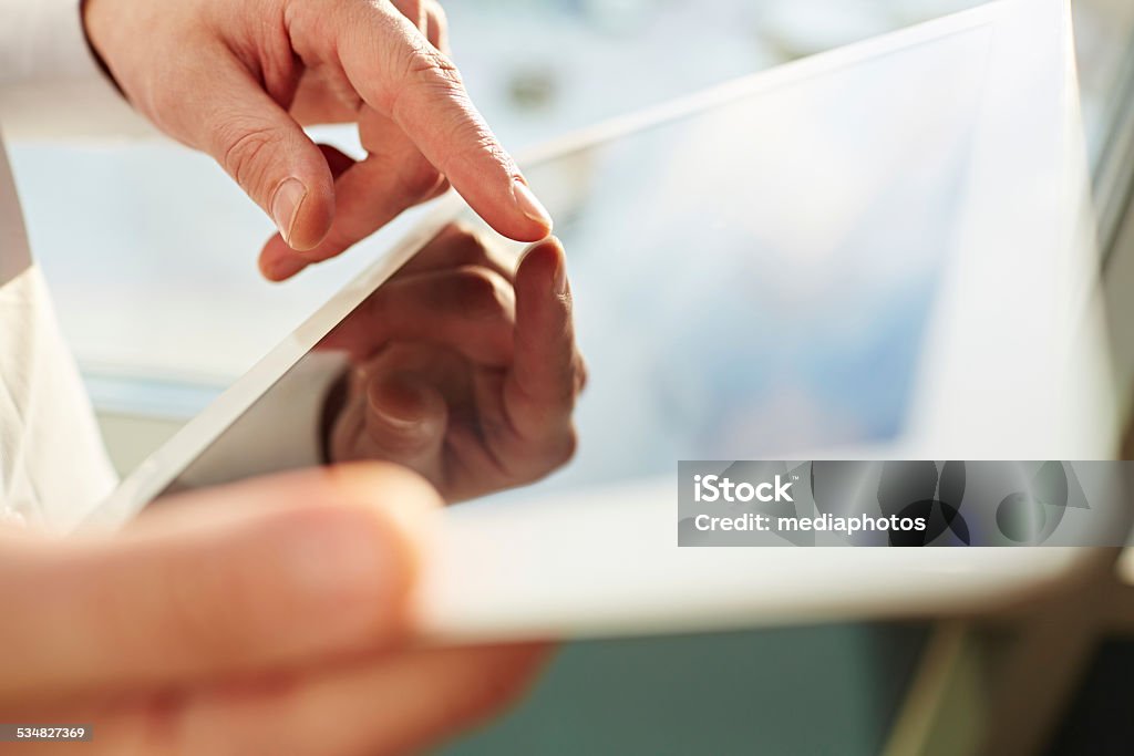 Touching screen Male hands using tablet computer 2015 Stock Photo