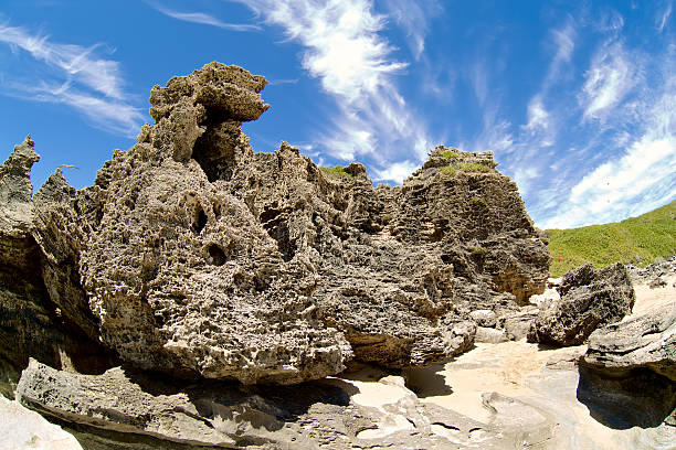 istock Big rock on the beach with blue clouds as background 534827893