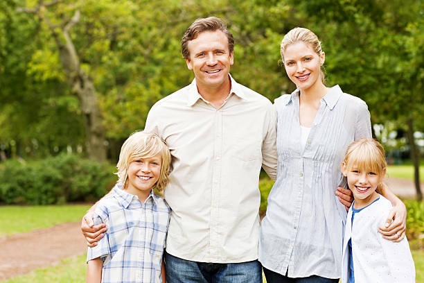 istock Happy parents with their kids smiling while on a holiday 534828091