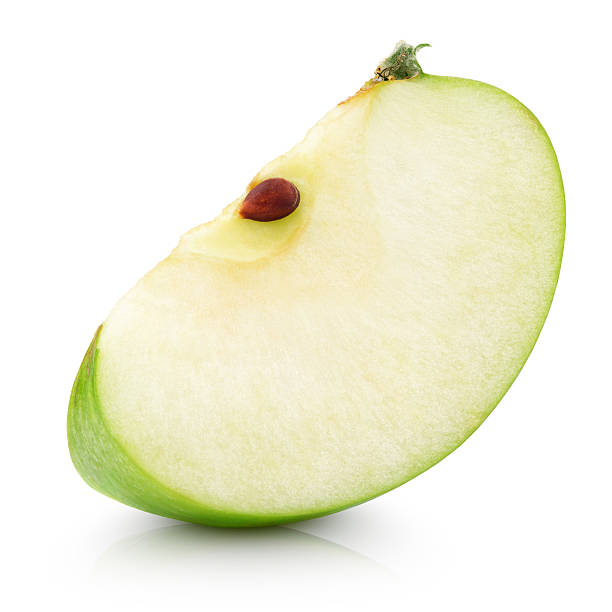 Green apple slice on white Green apple slice isolated on white with clipping path green apple slice stock pictures, royalty-free photos & images