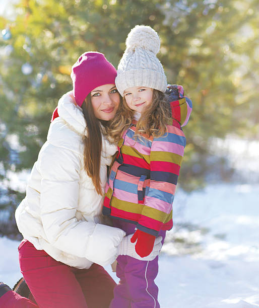 istock Winter and people concept - portrait mother with child 534829263