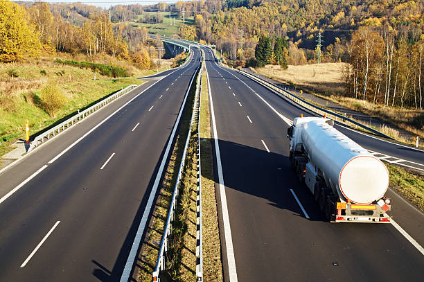 istock The highway between deciduous trees in autumn colors, white tank 534830159