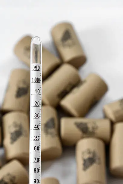 Photo of Hydrometer Scale in Front of Corks