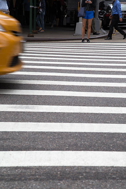 istock Blurry Taxi and people on Crosswalk 534844171