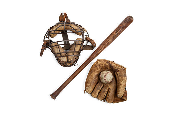 Vintage Baseball Equipment Vintage baseball equipment with catcher's mask, bat, ball and glove isolated on a white background catchers mask stock pictures, royalty-free photos & images