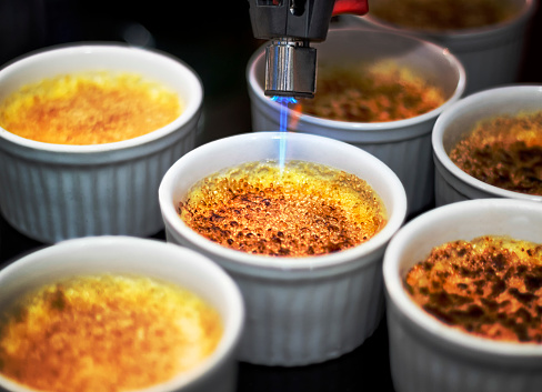 Color photography. Creme brulee and blowtorch.