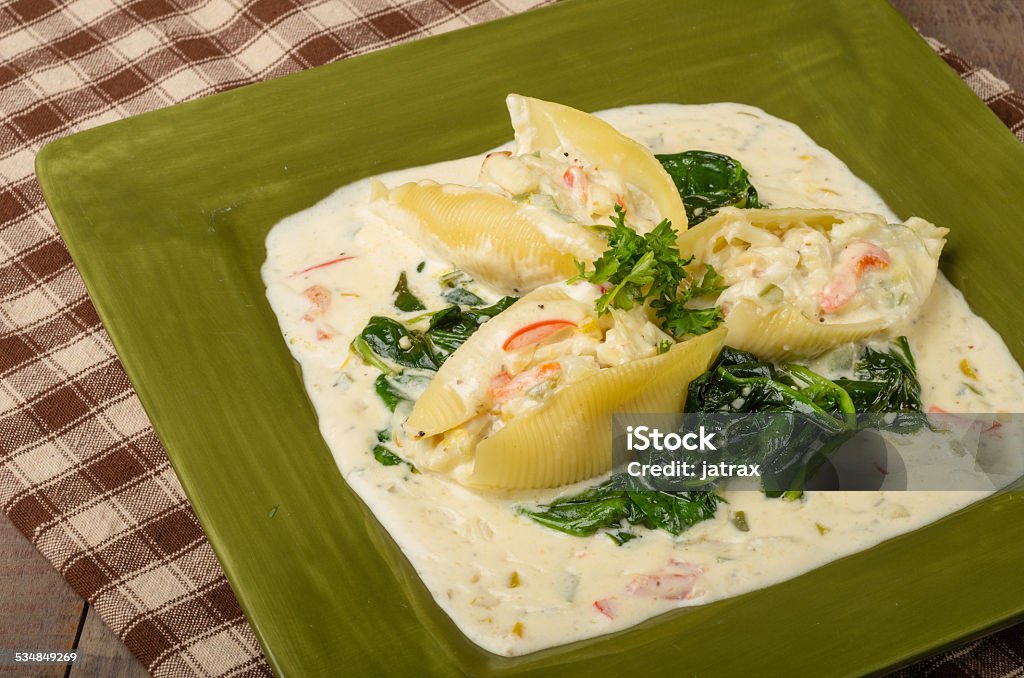 Pasta shells stuffed with crab Stuffed pasta shells with crab alfredo filling Crab - Seafood Stock Photo