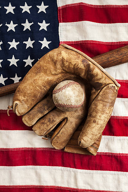 istock Vintage Baseball Equipment on American Flag 534852625