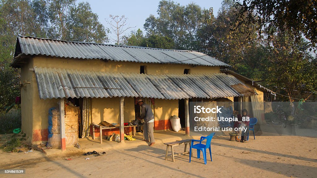 Traditional house in terai, Nepal Bardia, Nepal - March 14, 2014: Tharu people living in traditional house in terai, Nepal. Adobe is use to build house in Terai 2015 Stock Photo